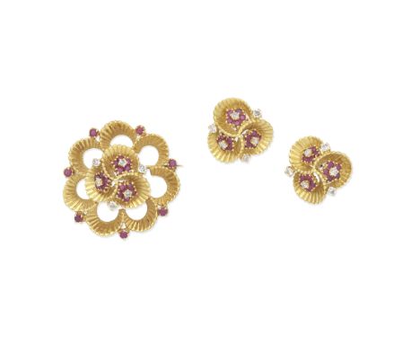 BEN ROSENFELD: RUBY AND DIAMOND BROOCH AND EARRING SUITE, 1962Each of abstract foliate form, the fluted mounts set with brill