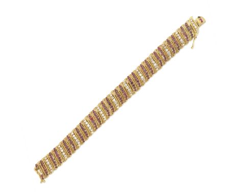 BEN ROSENFELD: RUBY AND DIAMOND BRACELET, 1965The articulated bracelet composed of scrolling openwork ropetwist links, altern