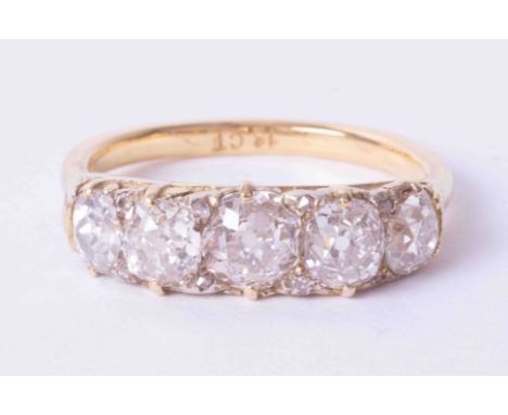 An 18ct Edwardian five stone diamond ring, total weight approx 3 carats, size R.