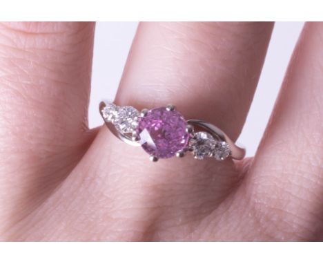 A platinum diamond and pink sapphire ring, size N.