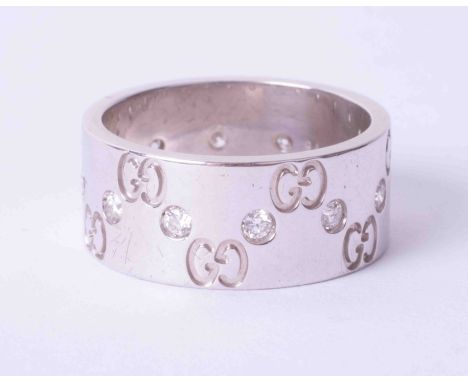 A Gucci platinum and diamond set wide band ring, size P/Q.