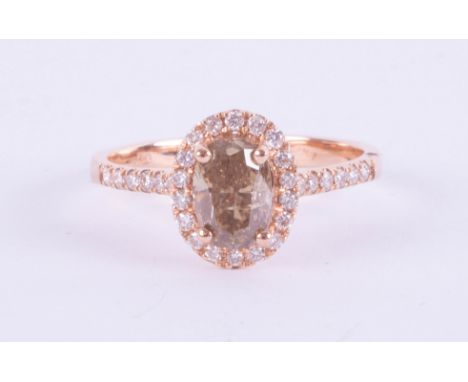 An 18ct rose gold champagne diamond halo set ring, approx. 1.10ct, ring size O.