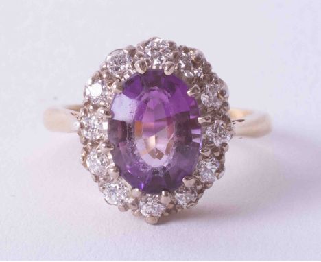 An 18ct yellow &amp; white gold amethyst &amp; diamond cluster ring, finger size L, no hallmarks.