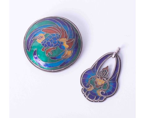 An enamel brooch, with decorated back panel '1917', 50mm diameter and another, both marked 'CSE'.