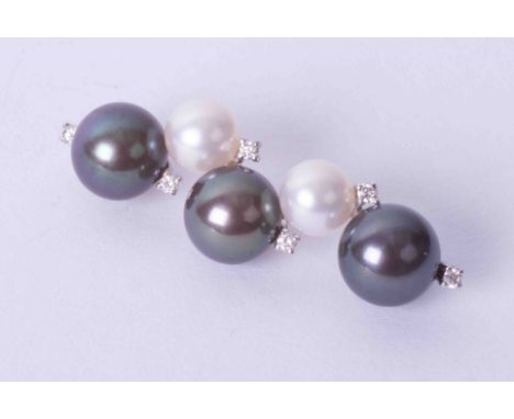 An 18ct pearl and diamond pendant.