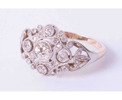 An early 20th century diamond ring, set with an arrangement of round cut diamonds, size R.