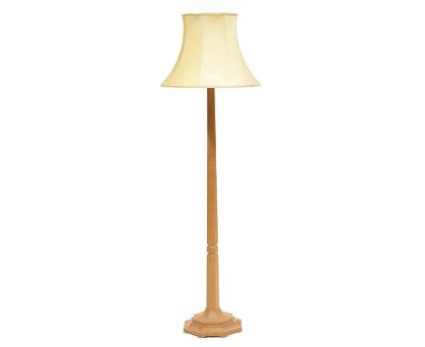 Robert 'Mouseman' Thompson of Kilburn, an oak standard lamp, tapering octagonal column, spreading base carved with signature 