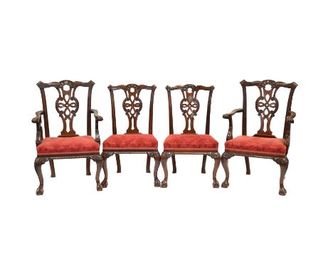 Set of ten Chippendale style mahogany dining chairs, pierced vase splats, with scrolls and strapwork, patterned upholstery, c