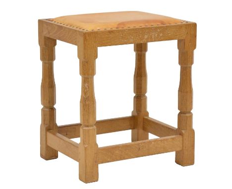 Robert 'Mouseman' Thompson of Kilburn, a leather topped oak dressing table stool, studded cowhide seat, raised on octagonal s