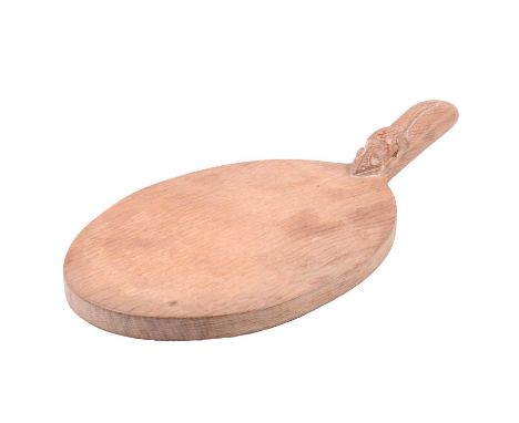 Robert 'Mouseman' Thompson of Kilburn, a carved oak cheeseboard, carved signature mouse to handle, 37cm.
