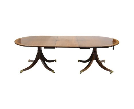 Regency style mahogany extending dining table, fitted with two leaves, rosewood banding with boxwood stringing and a reeded e