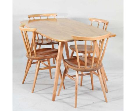An Ercol light elm dining table, on a splayed base, 151cm wide, together with a set of four Ercol stick back dining chairs (5