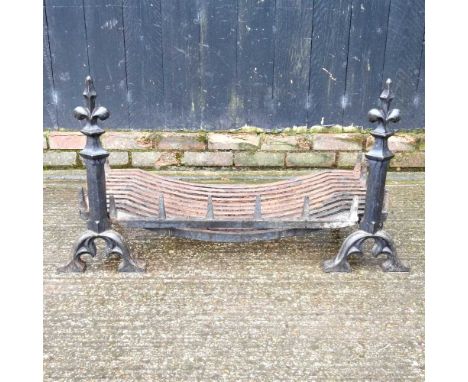 A large cast iron fire grate, 90 x 56cm, together with a pair of fire dogs, with fleur-de-lys terminals (3)