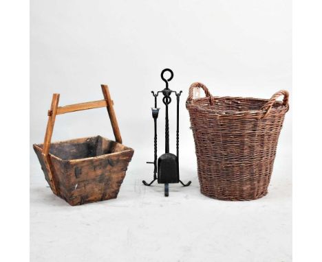 A wicker log basket, together with a companion set and a wooden trug