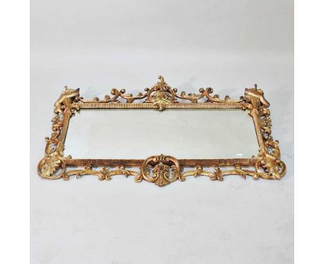 An ornate Chippendale style wall mirror, late 20th century, of rectangular shape, within an ornate scrolled surround, 78 x 11