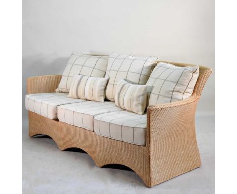 A modern Lloyd Loom wicker sofa, with loose cushions191w x 77d x 83h cmOverall condition is complete and usable, but with sig