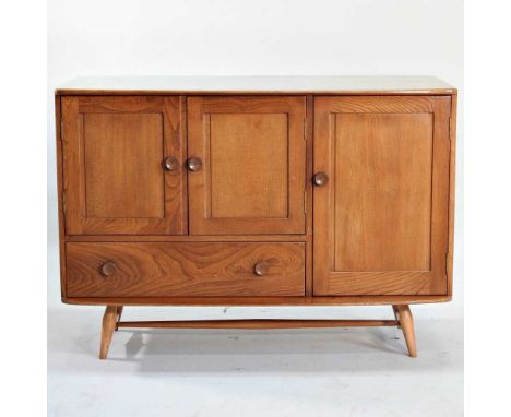 An Ercol light elm Windsor sideboard, on splayed legs114w x 51d x 81h cm