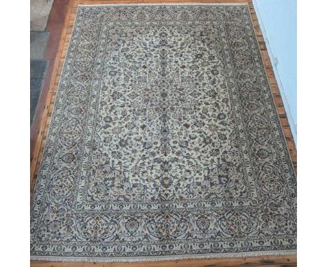 A Persian Kashan carpet, with foliate designs, on a cream ground, 400 x 300cm