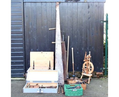 A collection of various tools, to include a two man crosscut saw