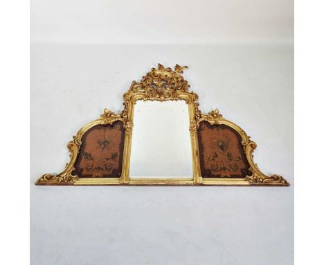 A late 19th century Italian gilt framed over mantel mirror, flanked by painted hunting scenes, 104 x 144cm overall