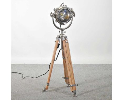 A modern standard lamp, in the form of a spotlight, on a tripod base, 108cm high
