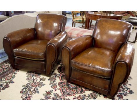CLUB ARMCHAIRS, a pair, vintage French tan hide leather each with scroll back and shaped arms, 85cm W. (2)