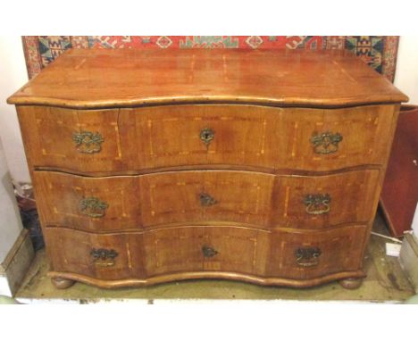 COMMODE, late 18th/early 19th century German oak, of serpentine outline fitted three long drawers, banded inlays, bun feet, 1
