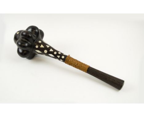 OCEANIC CLUB, hardwood with decorative mother of pearl inlays, carved handle, 49cm L.