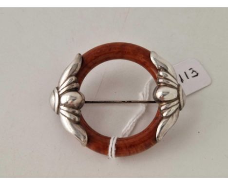 Vintage circular brooch with Silver shaped and scrolled mounts