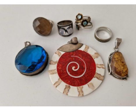 Four silver rings and three silver amber moonstone and Celtic design pendants