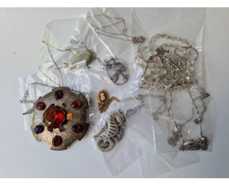 A bag of costume jewellery including a large Scottish amethyst and citrine coloured paste set brooch, all weighing 217g