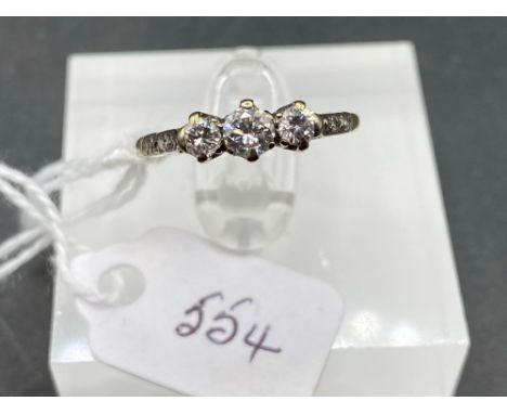 A early 20th century three stone diamond ring with diamond shoulders 18ct gold and platinum size M