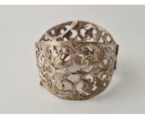 A large silver floral design hinge bangle 46 g
