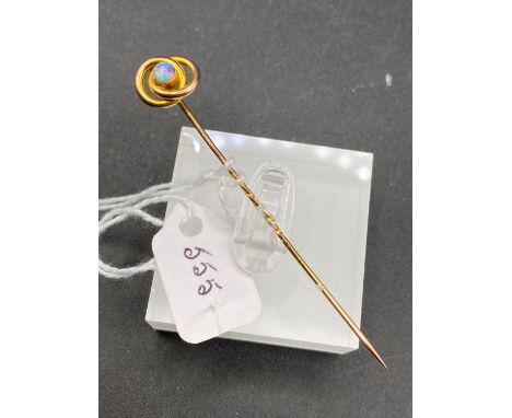 A fine Victorian double loop opal stick pin with fiery colours