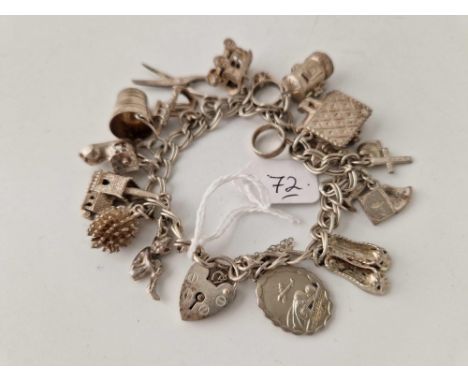 A silver vintage charm bracelet 54.8g