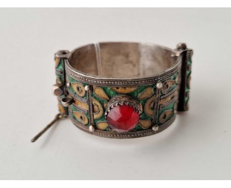 A tribal silver and enamel cuff bangle hinged 64 g