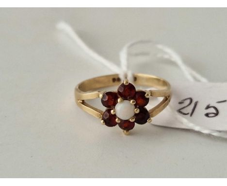 A opal and garnet ring 9ct size J