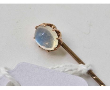 A gold topped moonstone stick pin