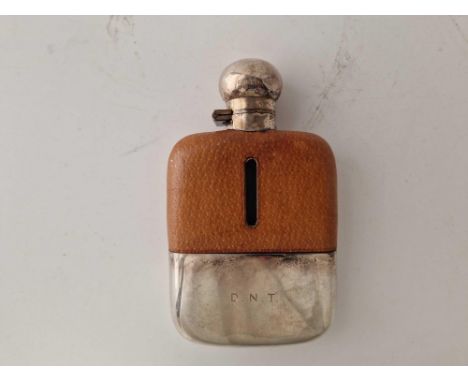 A good hip flask with glass and leather covered body, bayonet fitting and cup base, Sheffield 1966