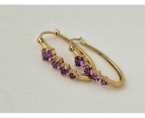 A pair of amethyst 9ct hoop earrings 2.5g