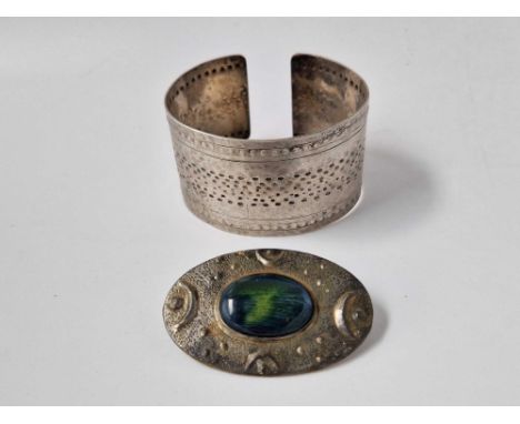 A pewter bangle and brooch