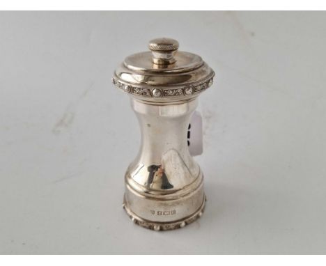 A good quality pepper mill with Celtic style rims, Birmingham 1971