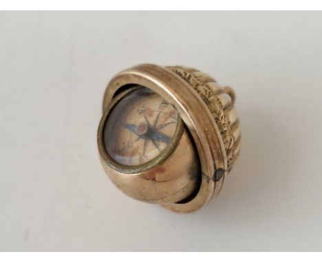 An unusual gold mounted compass fob, 7.4 g