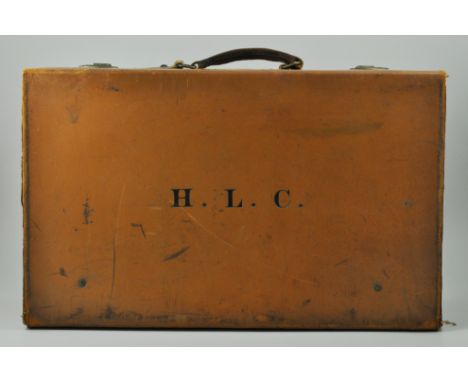 Vintage leather suitcase, initialled to front, "H.L.C.", together with two mink hats, (3).