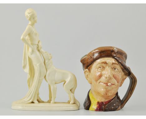 Royal Doulton large character jug, "Arry", D6207, together with a 1930's Art Deco style figural group of a Lady and Dog, (2).