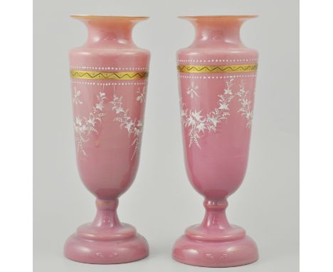 Pair of pink opaque glass pedestal vases, enamel decoration with festoons and insects, 27cm.