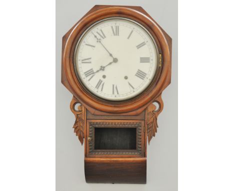 American walnut and stained wood wall clock, white enamel, octagonal frame, 68cm.