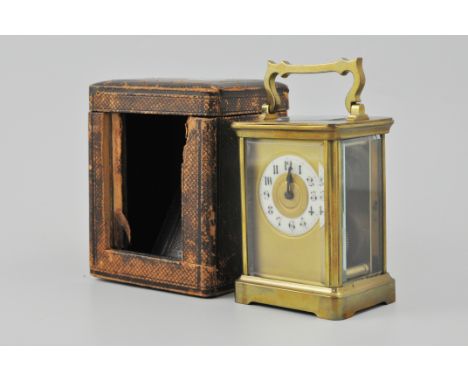 French brass cased carriage clock, ivorine chapter ring, platform escapement, 12cm in a morocco case.
