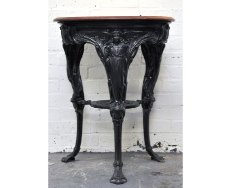 Vintage pub table, circular wooden top, cast iron base with figures, diameter 60cm.