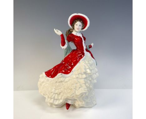 Lovely figural dressed in holiday colors of red, white and green. Royal Doulton backstamp. This item has its original box: 7"